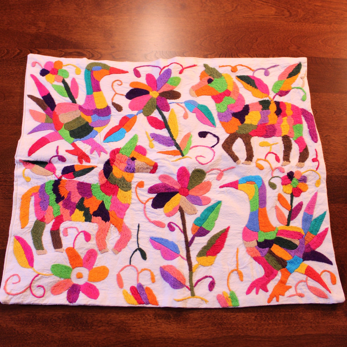 Hand-embroidered Tenango pillow cover with animals in white - Mexican artisan home décor