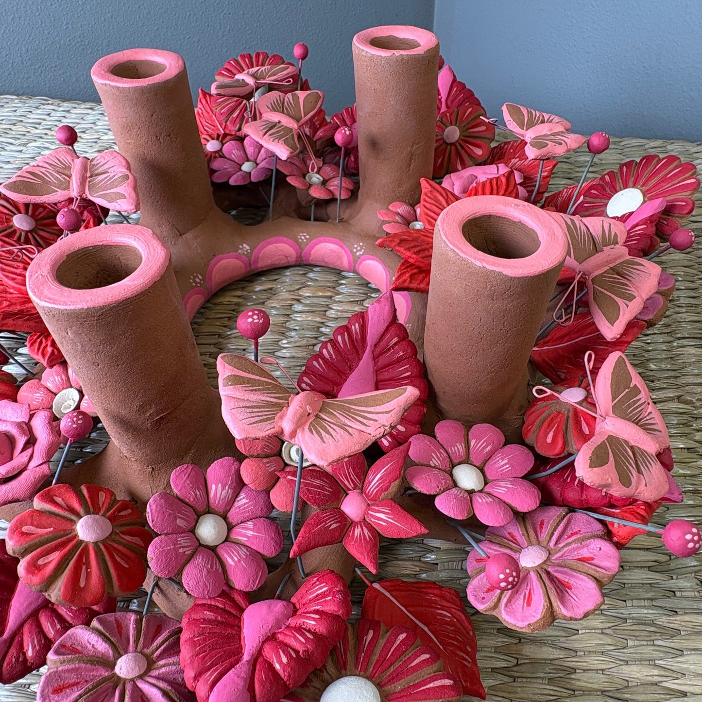 Handmade Mexican pottery clay , candle holder featuring intricate pink and red decorations
