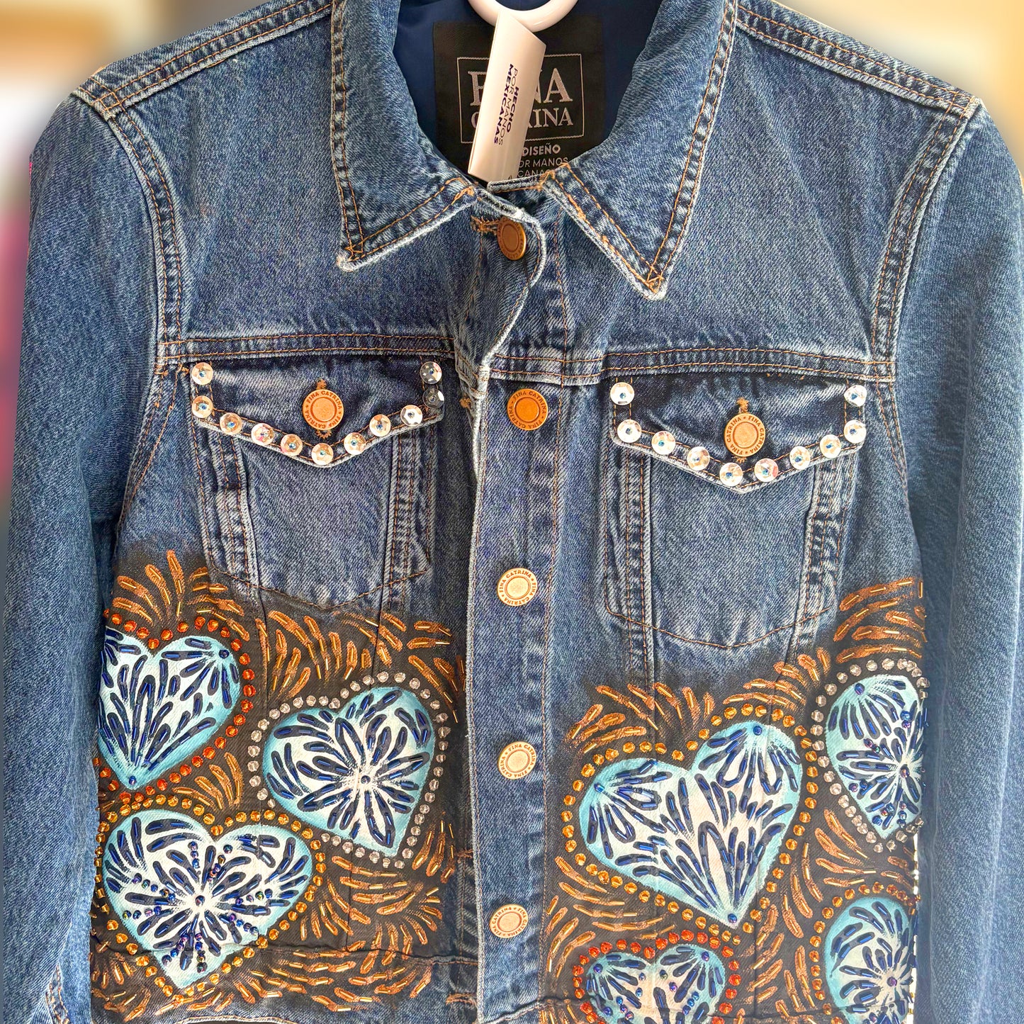 Hand-embroidered denim jacket with Talavera tile design - Mexican artisan fashion