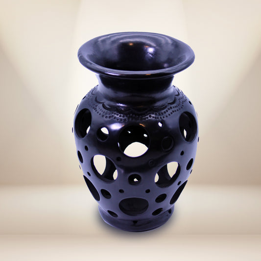 Hand carved vase with round design