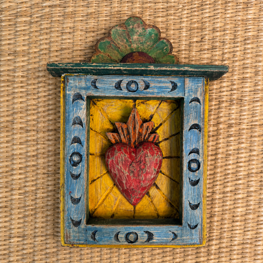A beautiful crafted hand-carved wall frame in the shape of a heart, ideal for creating a perfect decorative center piece