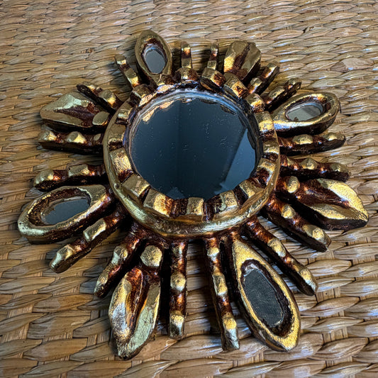 Sunburst Wall Mirror featuring handc-carved wood with gold leaf and glass accents. size Medium