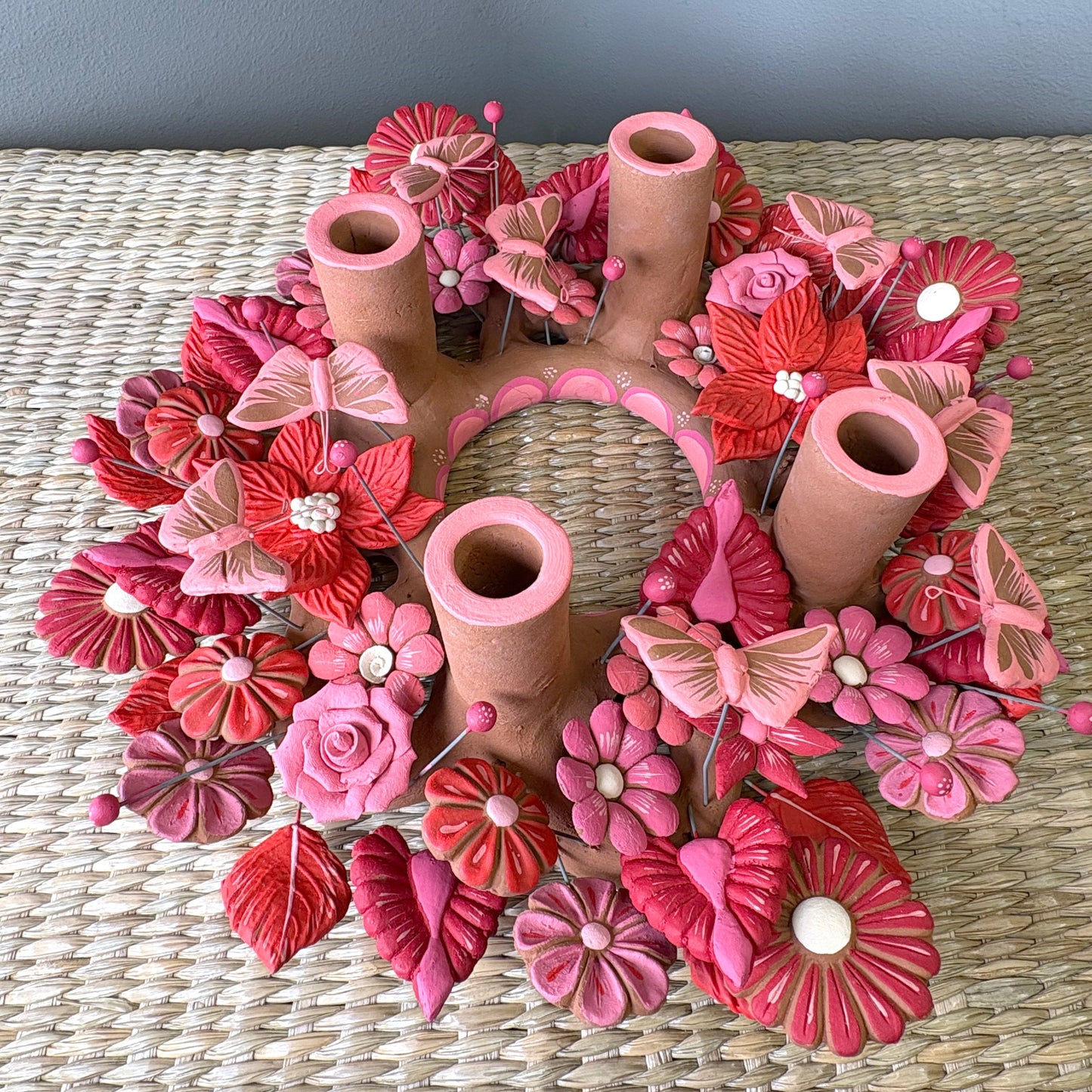 Handmade Mexican pottery clay , candle holder featuring intricate pink and red decorations