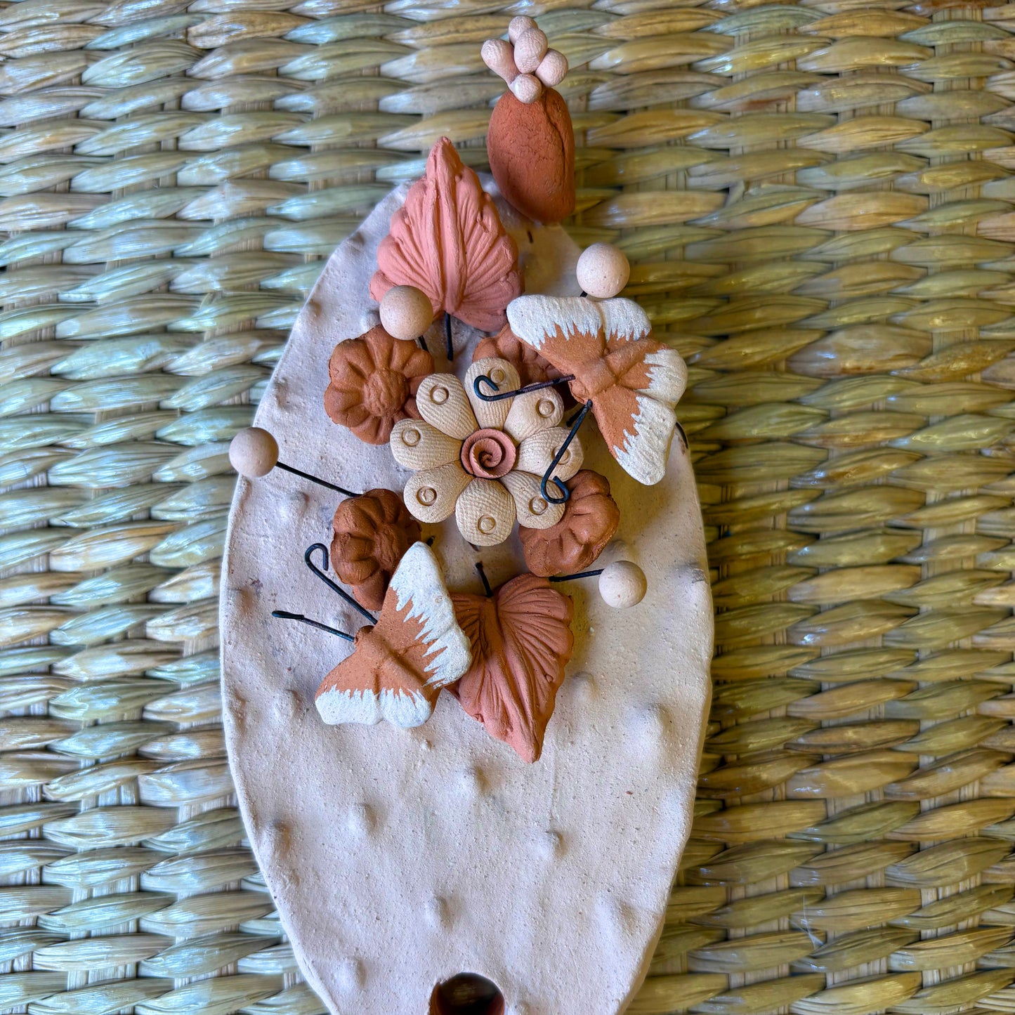 Handcrafted clay "Cactus" with decorative flowers and butterflies in earthy tones