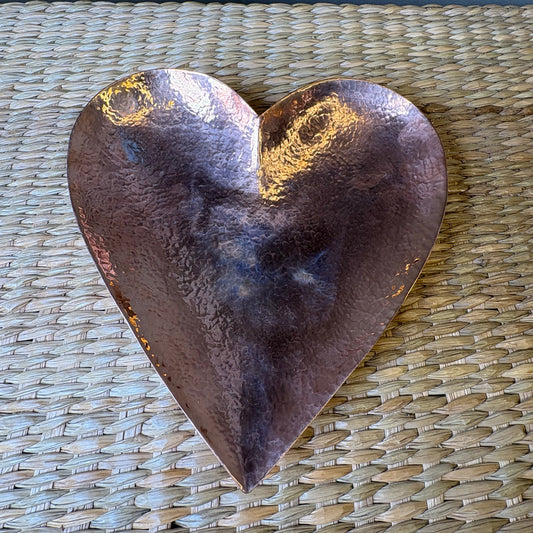 Beautiful hand-hammered heart shaped copper dish that ften serves as a decorative bowl or tray.