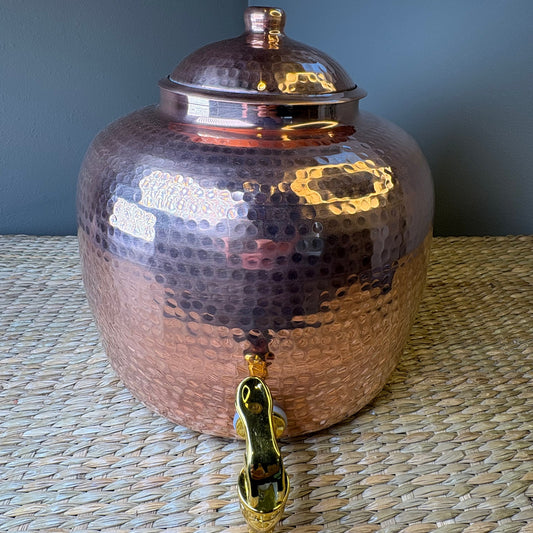 handcrafted hammered copper water dispenser; commonly used for storing and dispensing drinking water.Capacity for 8 litters