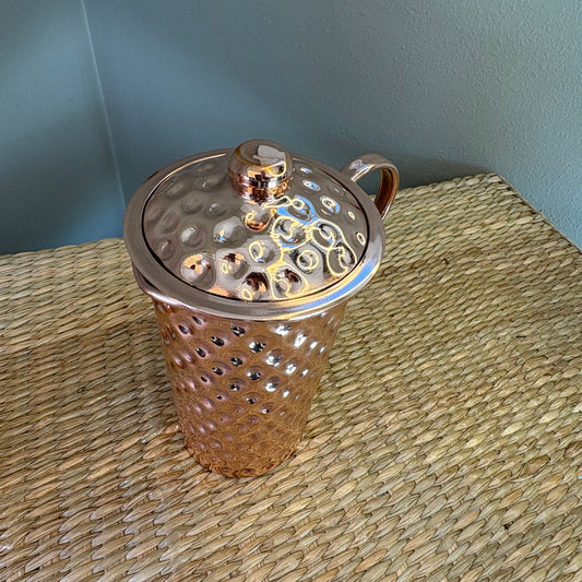 Hammered copper water pitcher (or jug) .