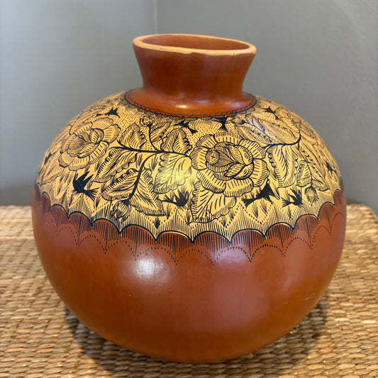 Handcrafted vessel from Michoaacan-Mexico. Featuring intricate hand-painted floral designs on a red clay. Natural burnishead, traditional decorative vase.