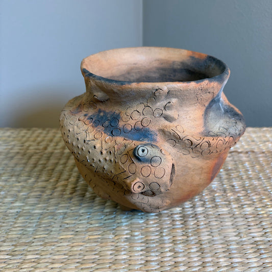 Clay Vase is designed for decorative use. It's natural , porous clay may allow moisture to seep.