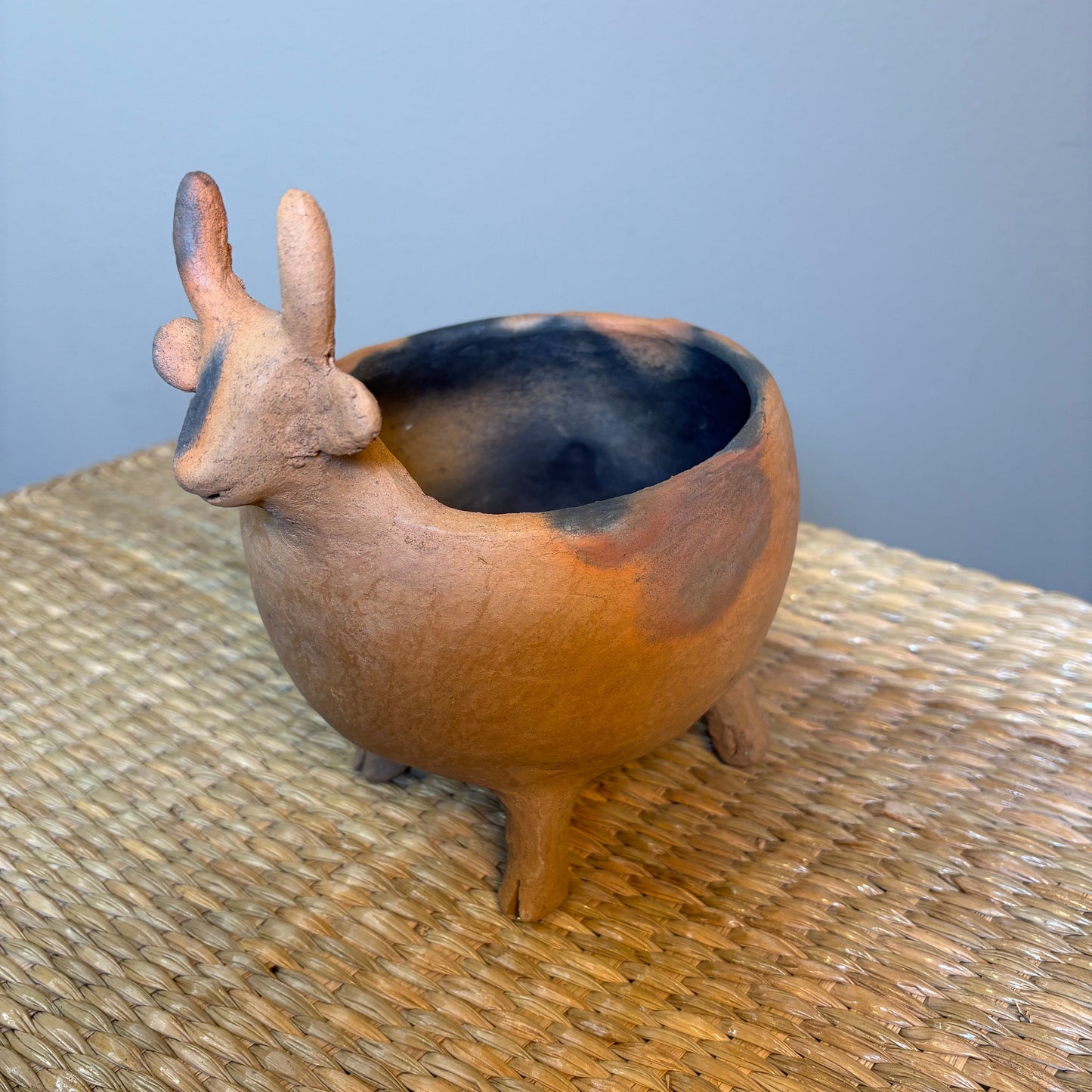 "Pot-Bull clay planter"A sculptural clay from handcrafted in Zipiajo, Michoacan-shaped in the likeness of a single animal.Each figure is a personal ancestral technique and smoke-fired for organic depth and character.