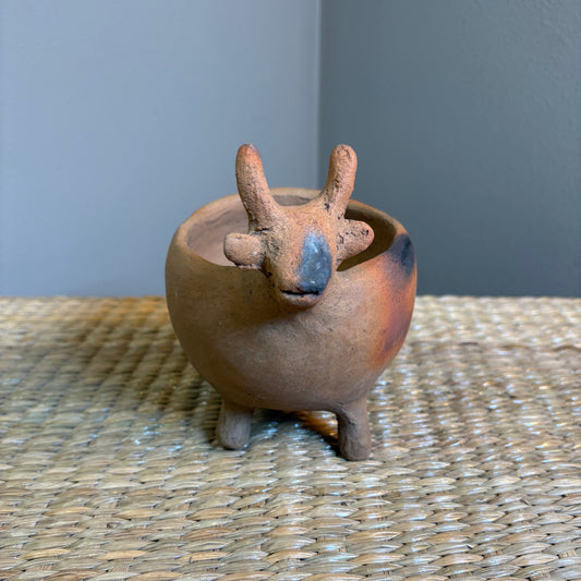 "Pot-Bull clay planter"A sculptural clay from handcrafted in Zipiajo, Michoacan-shaped in the likeness of a single animal.Each figure is a personal ancestral technique and smoke-fired for organic depth and character.