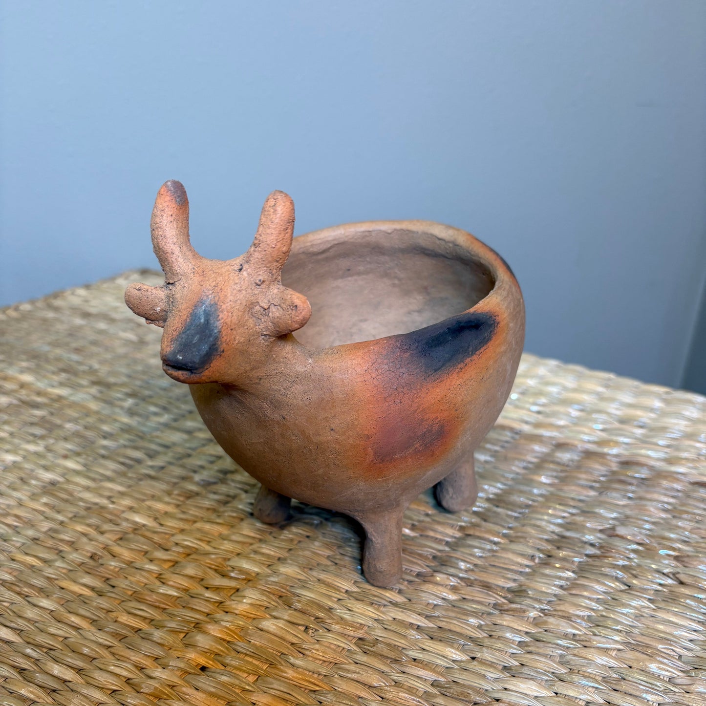 "Pot-Bull clay planter"A sculptural clay from handcrafted in Zipiajo, Michoacan-shaped in the likeness of a single animal.Each figure is a personal ancestral technique and smoke-fired for organic depth and character.