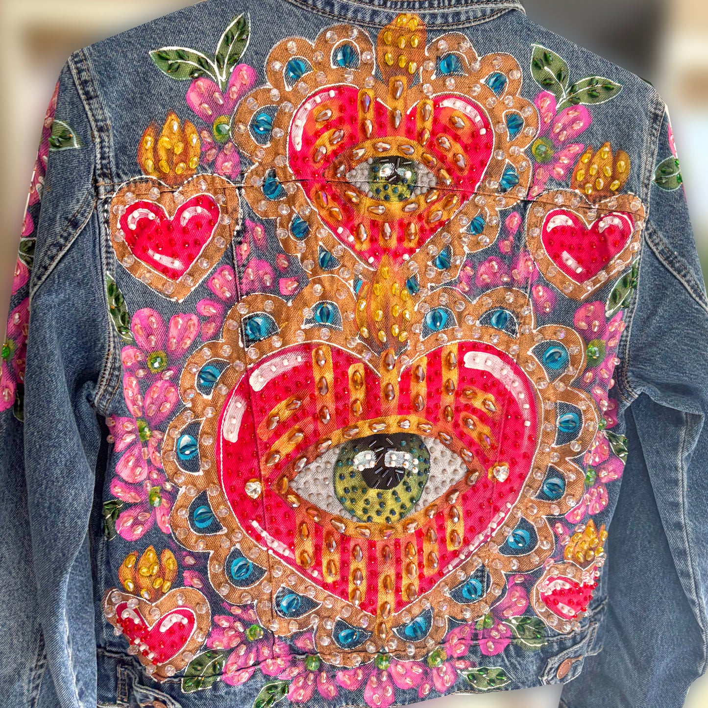 Hand-embroidered denim jacket with hearts and eyes design - Mexican artisan fashion