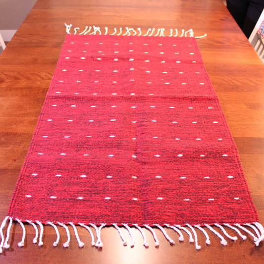 Wool rug in red colors