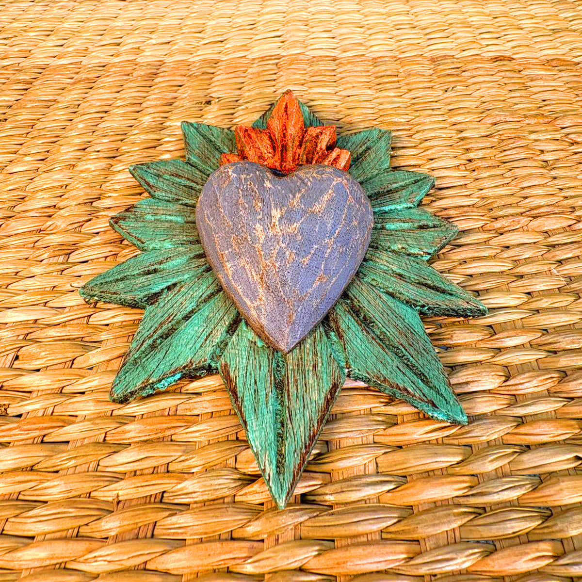 Carved wood heart hand painted.