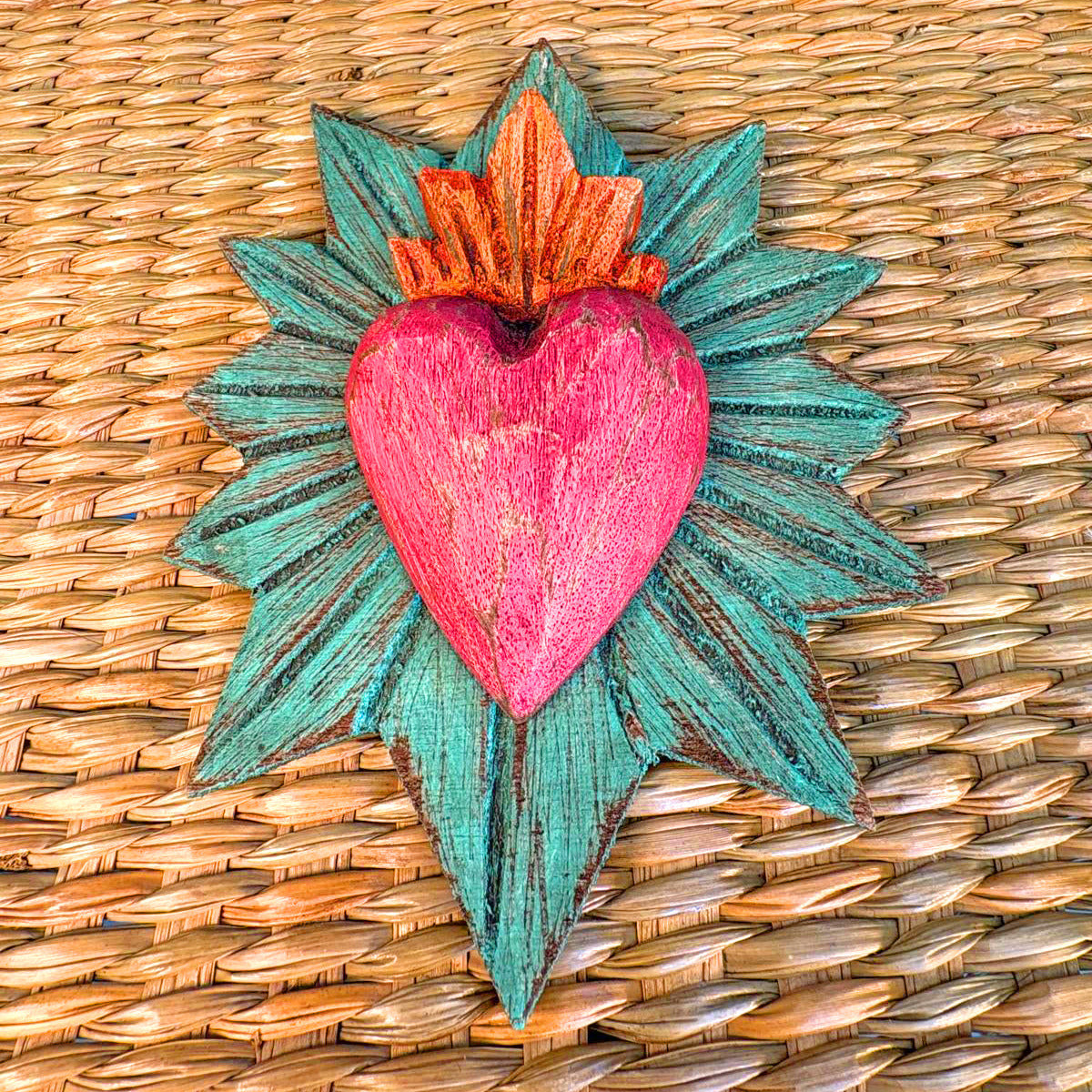 Carved wood heart hand painted.